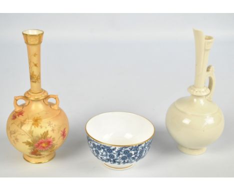 A Royal Worcester blush ivory floral decorated twin handled vase of globular form with slender tapering neck, raised on sprea