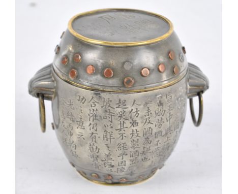 A Chinese 19th century barrel shaped tea caddy with twin handles, decorated with faux rivets, and multiple Chinese characters