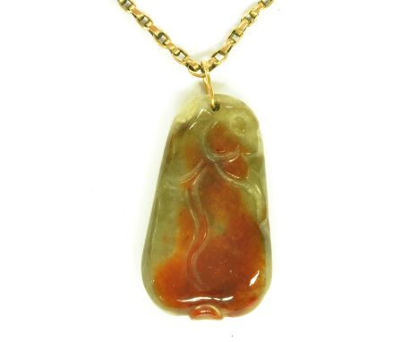 A 9ct yellow gold chain supporting a lilac green and burnished red included carved Chinese jade pendant, length of pendant 4.