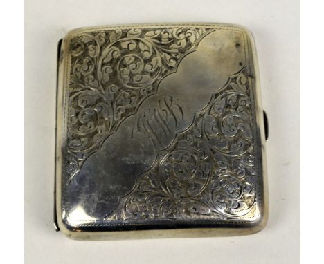 W G KEIGHT & CO; an Edward VII hallmarked silver curved rectangular cigarette case overall engraved with foliate scroll, init