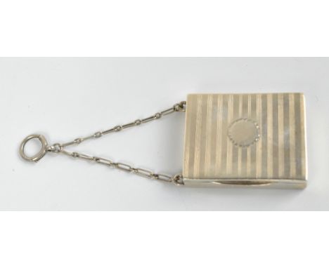 A George V hallmarked silver rectangular overall engine turned decorated powder compact/pill box with mirrored interior centr