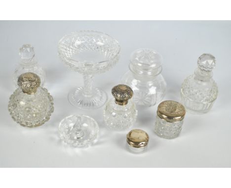 A group of clear glass dressing table items to include two globular hobnail cut silver topped scent bottles, one by MMH, Birm