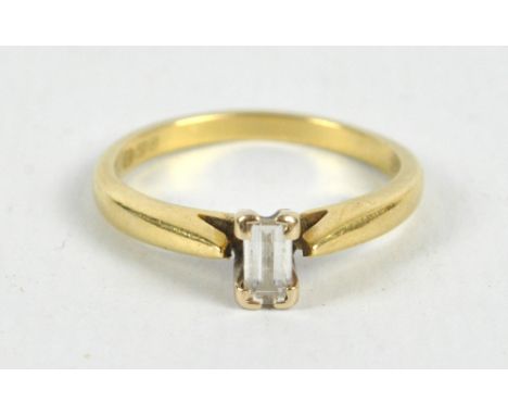 An 18ct yellow gold and diamond solitaire ring, the baguette cut stone 5 x 3mm in claw setting, size L, approx 3.1g.