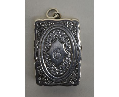 GEORGE UNITE; a Victorian hallmarked silver shaped rectangular vinaigrette with bright cut decoration and shaped cartouche, i