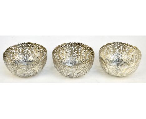 LUEN WO; a set of three late 19th/early 20th century Chinese export silver circular bowls with floral and foliate scroll pier