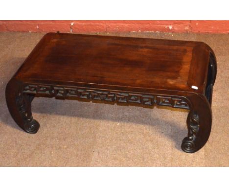 A Chinese huang huali low scroll table with pierced Greek key frieze and scrolling supports, length 94cm.