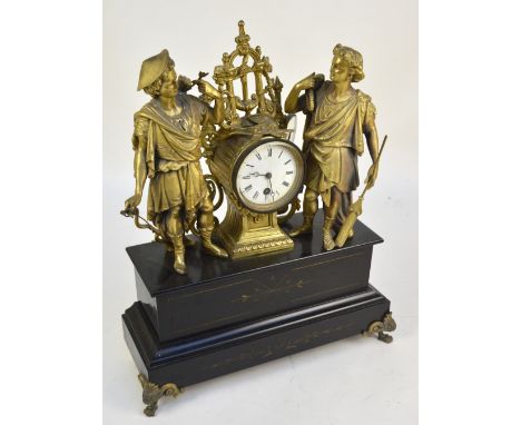 A late 19th century French thirty hour mantel clock, the circular enamel set with Roman numerals, flanked by two gilt spelter