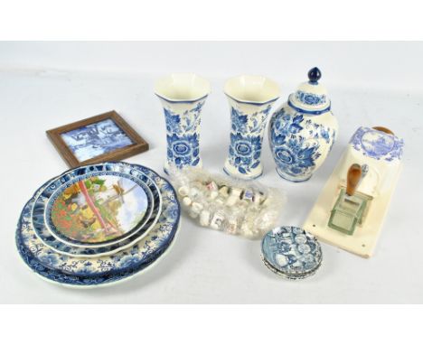 A quantity of 20th century Delftware including a pair of vases, a number of various plates, wall coffee grinder, etc and a co