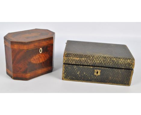 A late George III mahogany and satinwood inlaid octagonal tea caddy with a navette shaped bone escutcheon, width 17.5cm, and 