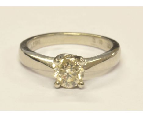 A platinum diamond solitaire ring, the round brilliant cut stone approx 0.96cts within a four claw setting, size M 1/2, appro