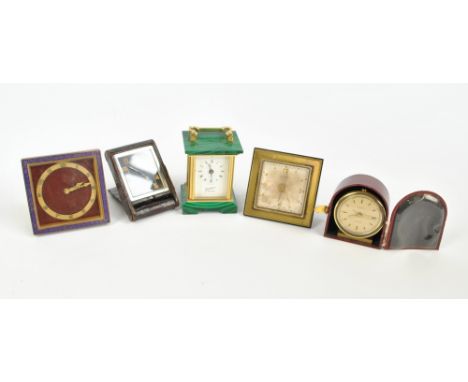 Four travel clocks to include a mock croc cased eight day Jaeger  example with Arabic numerals and a square cased enamel Kien
