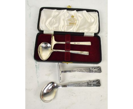 VINER'S LTD; a cased pair of Elizabeth II hallmarked silver baby food pusher and spoon, Sheffield 1999, and a further electro