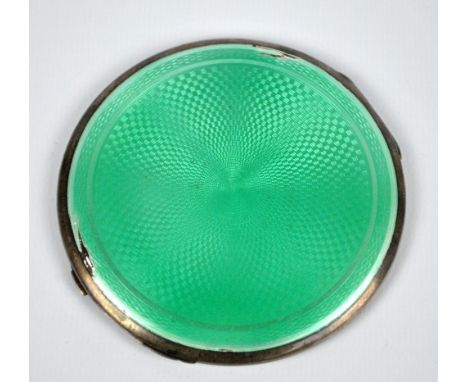 CRISFORD & NORRIS; a George V hallmarked silver and green guilloche enamel decorated circular powder compact, Birmingham 1932