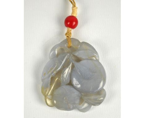 A late 19th/early 20th century carved agate pendant modelled as a bird perched on blossoming branches to both sides, 5 x 4cm.
