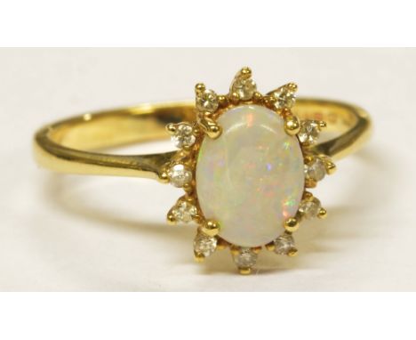 A 9ct yellow gold diamond and opal floral cluster ring, size P 1/2, approx 2.2g.