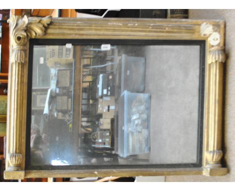 A Regency gilt framed overmantel mirror with fluted pilasters, acanthus scrolls and ebonised slip, approx 99 x 65cm.