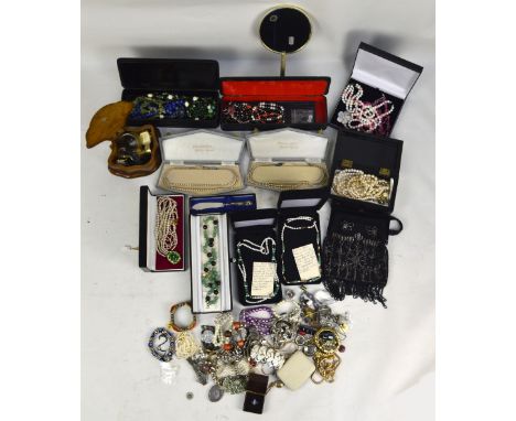 A large quantity of costume jewellery including various beads, gilt metal and white metal necklaces, bangles, faux pearl neck