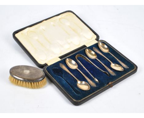 JAMES DIXON & SONS LTD; a cased set of five George V hallmarked silver teaspoons with scrolling foliate decoration, with matc