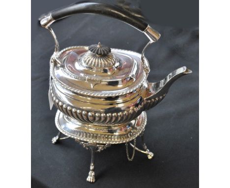WILLIAM AITKEN; an Edward VII hallmarked silver spirit kettle of oval form with part gadrooned decoration, with ebonised hand