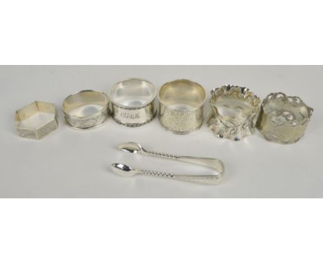 Five variously hallmarked silver napkin rings to include hexagonal engine turned decorated example, Crisford & Norris, Birmin