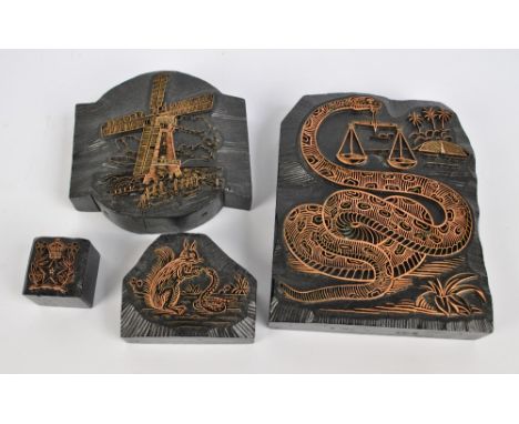 Four printing blocks of varying sizes, the largest depicting a serpent with a set of balanced scales, 26 x 20cm (4).