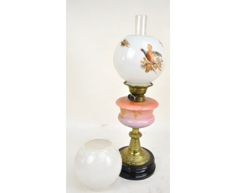 A Victorian 'duplex' brass oil lamp with graduated ink glass reservoir, with later globular opaque glass shade with pheasants