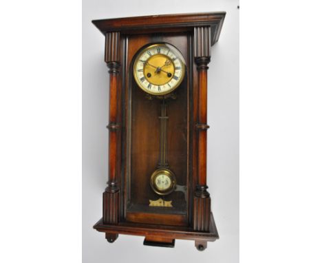An early 20th century Vienna style eight day wall clock, the circular chapter ring set with Roman numerals, the dial with Ham