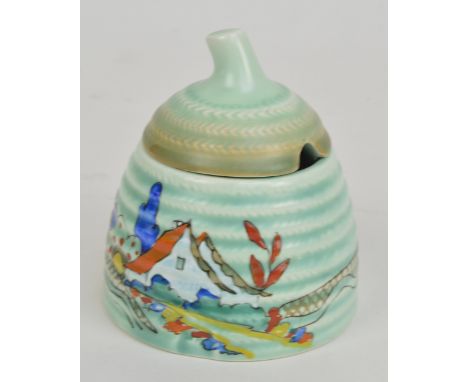 CLARICE CLIFF; a Wilkinson Ltd 'Chalet' pattern 'Lynton' shape honey pot and cover on light turquoise ground, marked to base,