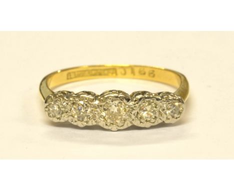 An 18ct yellow gold illusion set five stone diamond ring, size N, approx 2.8g. CONDITION REPORT: Stones with visible inclusio