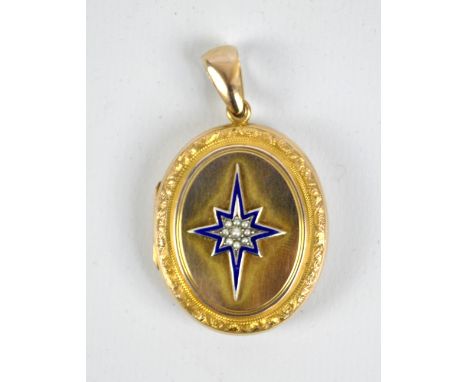 A large Victorian gold plated oval locket pendant with applied enamel detail and seed pearl set starburst motif, 3.8 x 3cm ex