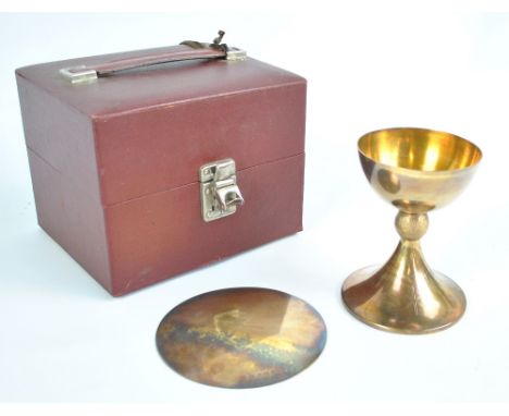 ALBERT EDWARD JONES; a cased Elizabeth II hallmarked silver gilt chalice with textured knopped stem above spreading circular 