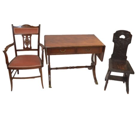 An Edwardian mahogany and inlaid elbow chair, a reproduction sofa table and a hardwood carved chair (3).