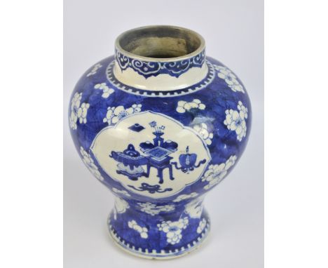 A large Chinese blue and white baluster vase painted with vignettes featuring various auspicious symbols on a cracked ice and