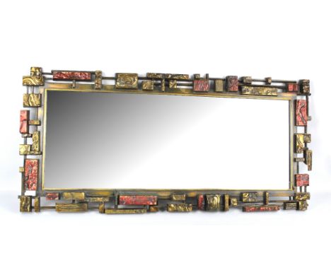 A 1960s rectangular mirror with geometrically decorated frame, 108 x 51cm (af).