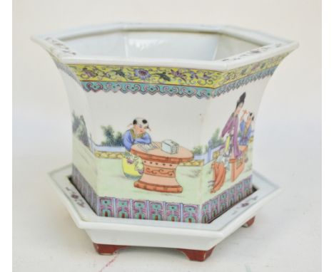 A circa 1900 Chinese porcelain hexagonal jardinière and stand painted in enamels with figural garden scene and with artists c