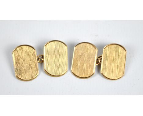 A pair of 9ct yellow gold rounded rectangular engine turned decorated cufflinks, approx 3.8g.