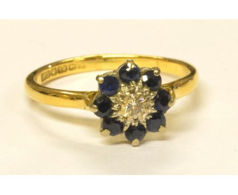 An 18ct yellow gold floral set diamond and sapphire ring, size P 1/2, approx 3.5g. CONDITION REPORT: Sapphires scratched and 