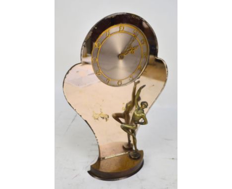 An Art Deco Smith's eight day mantel clock with a spelter dancing girl against a shaped peach mirror and a walnut base, the c