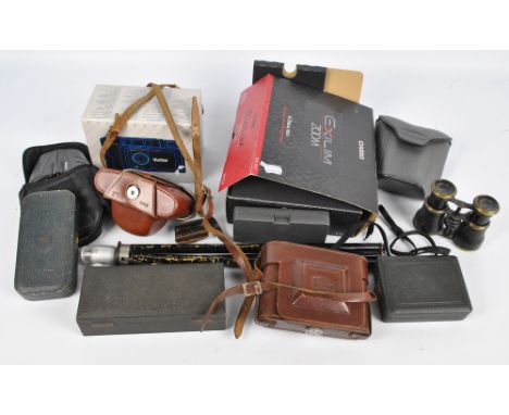 A quantity of cameras and binoculars including a boxed Vivitar DC750, an Ikonta Zeiss-Ikon camera in leather case, and furthe