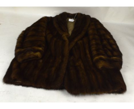 A brown ranch mink jacket with shawl collar and turn back cuffs, with coffee silk lining and a further brown mink jacket with