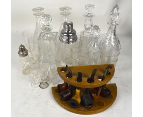 A pair of cut glass conical decanters, four further decanters, a small quantity of drinking glasses, a cocktail shaker and a 