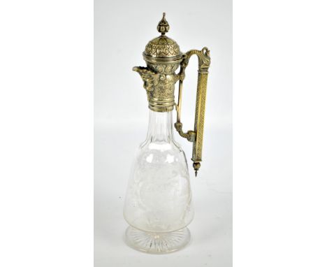 A Victorian electroplated mounted clear glass claret jug, possibly Stourbridge, with globular top, mask shaped beak and geome