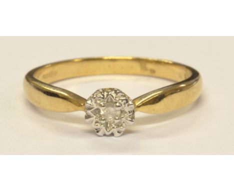 A 9ct yellow gold and single stone illusion set diamond ring, size P, approx 1.8g.