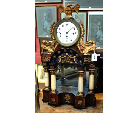 A 19th century French walnut portico eight day clock, the circular enamel dial set with Arabic numerals (af), surmounted with