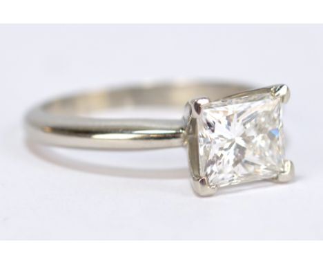 A platinum and diamond solitaire ring, the princess cut stone weighing 2.12ct, colour E, clarity SI1 (no fluorescence), in 4 