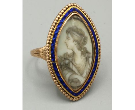 Georgian gold coloured metal navette shaped mourning ring, painted with a half length portrait of a lady in blue enamel and b