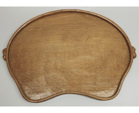 Robert Mouseman Thompson of Kilburn - an adzed oak kidney shaped galleried tray, carved with two signature Mouse, handles, W1