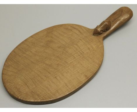 Robert Mouseman Thompson of Kilburn - an oak oval cheese board, curved handle carved with signature Mouse, W37cm D19cm 