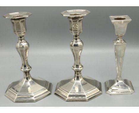 Pair of C18th style silver hallmarked octagonal candlesticks, with detachable sconces and single knop column on tapering step