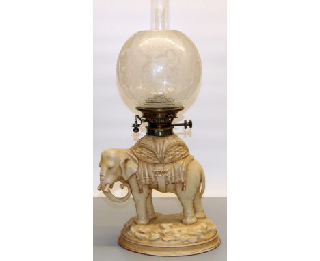 Victorian porcelain elephant oil lamp by Alfred Stellmacher, with Hinks Duplex brass fitting, clear glass chimney and etched 
